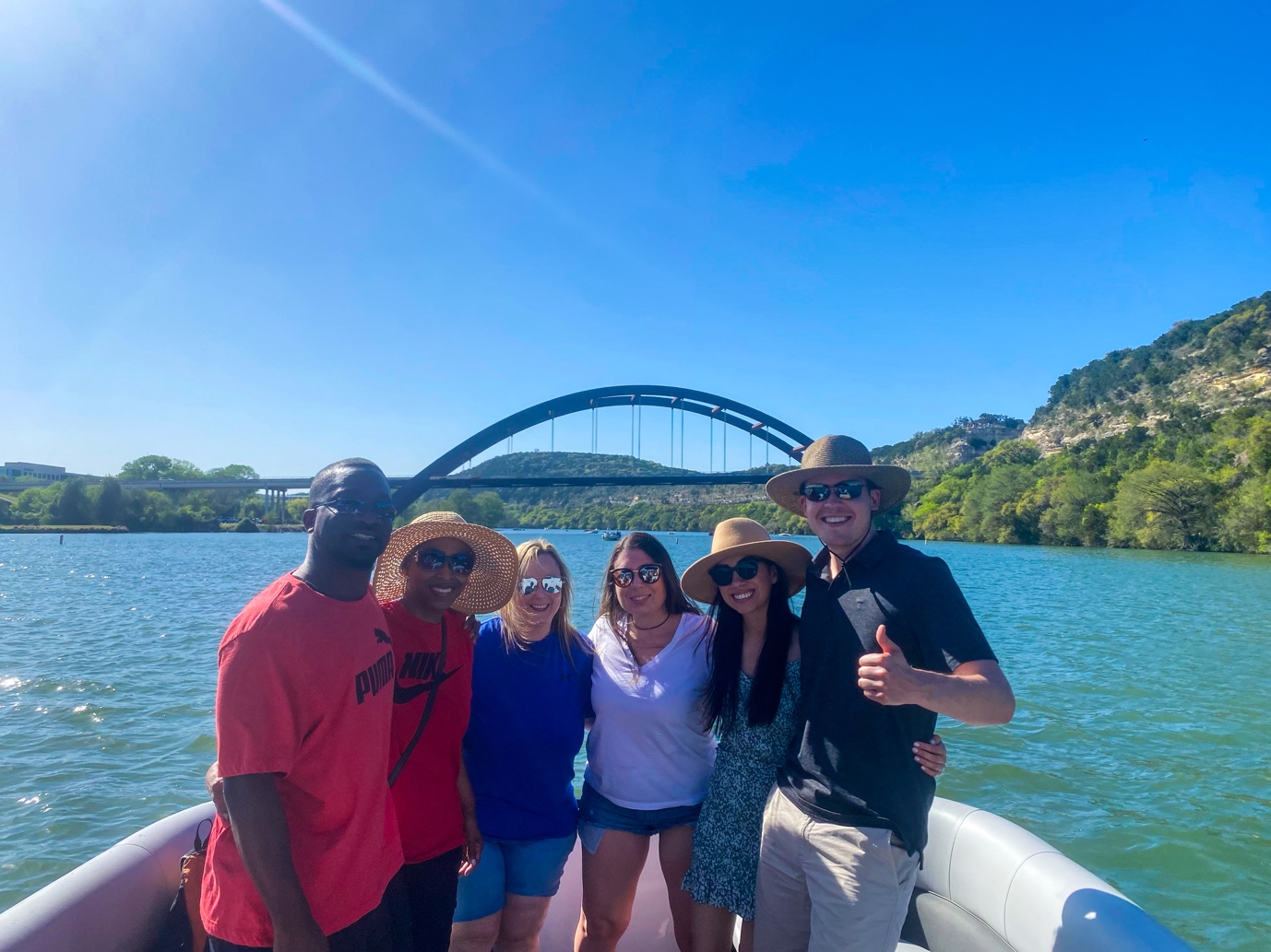 People posing on a pontoon boat