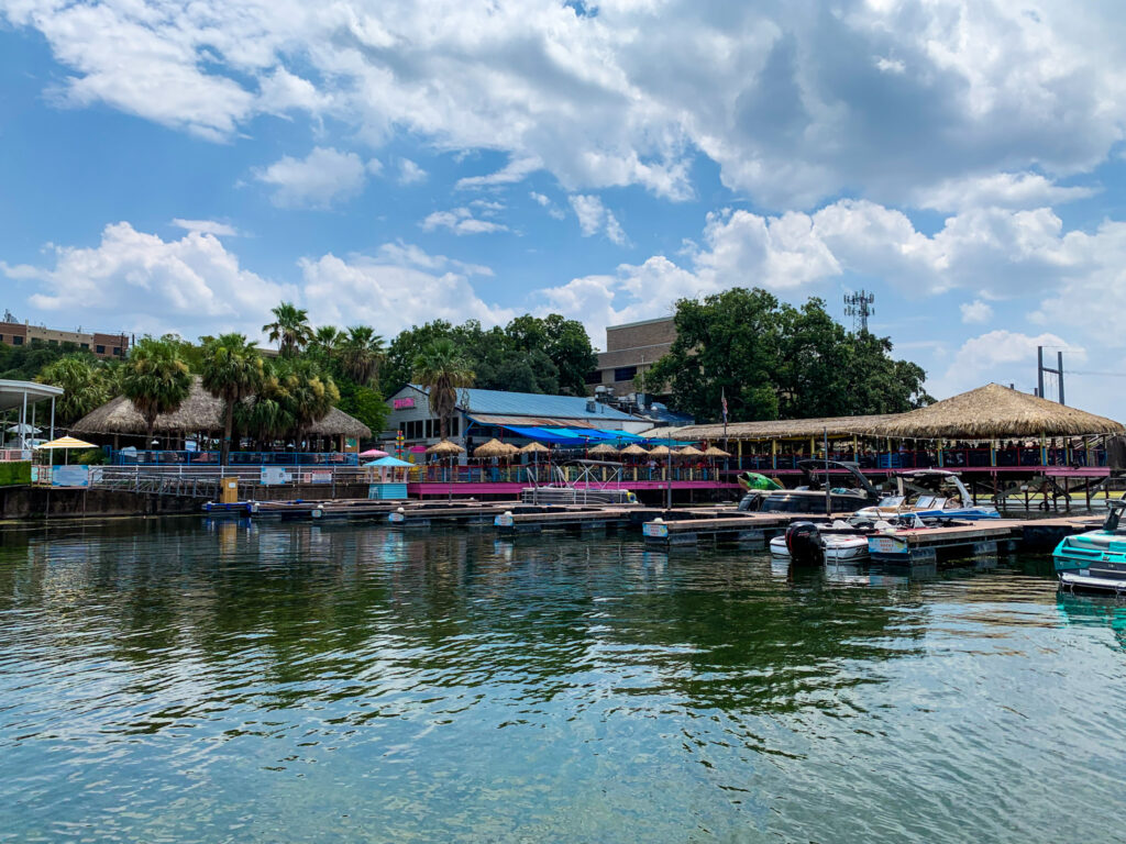 Hula Hut waterfront restaurant on Lake Austin viewed from the water