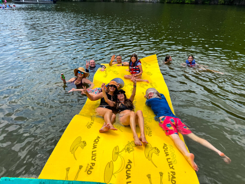 Family enjoying Wake Riderz boat rental on Lake Austin TX in a quiet cove”