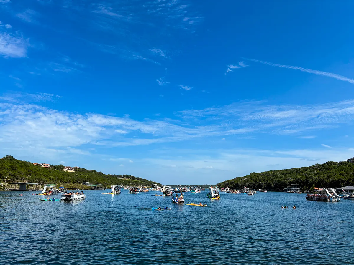 Captained pontoon boat rental cruising on Lake Travis