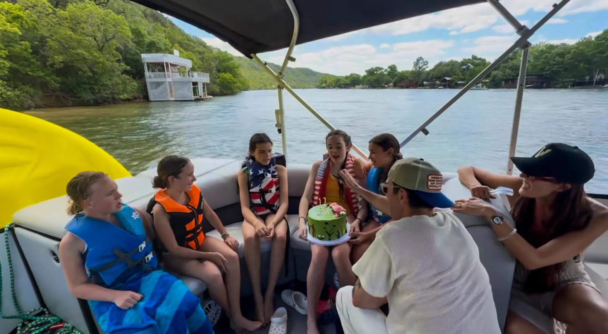Birthday group celebrating on a private Wake Riderz pontoon boat on Lake Austin