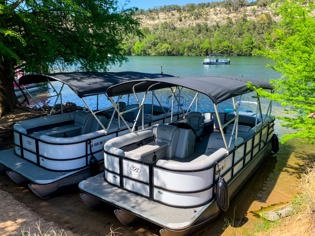 Two Wake Riderz Bentley pontoon boats with Bimini shade on Lake Austin