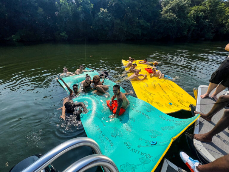 A corporate event enjoying the Aqua Lily Pad with Wake Riderz's Corporate Boat Rental