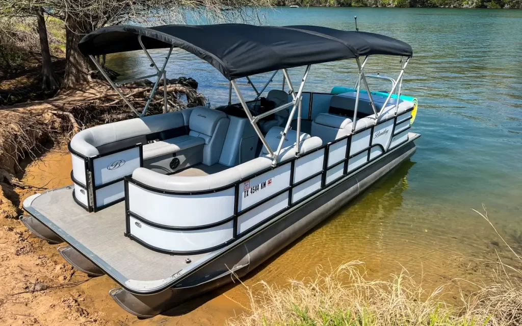 Sofia boat rental on Lake Austin with full sun shading and Bluetooth speakers
