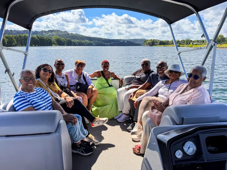 Women’s group enjoying a relaxing Lake Austin pontoon tour with clear skies and scenic shoreline views