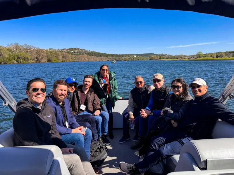 Corporate boat event on Lake Austin with captained pontoon boat rental for team building and client entertainment