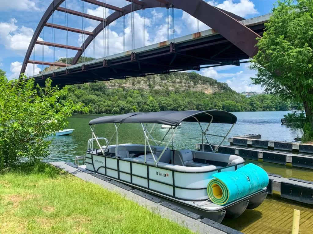 Pontoon boat rental on Lake Austin with full shade canopy at Loop 360 boat ramp