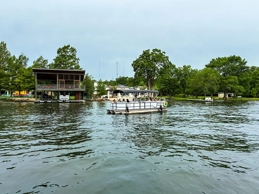 Captained Austin boat rental on Lake Austin with a shaded pontoon boat